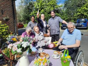 residents outside in sunshine at easter