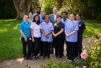 group staff photo outside the care home