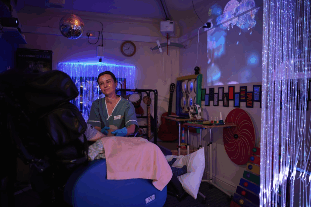 resident with nurse in the sensory room