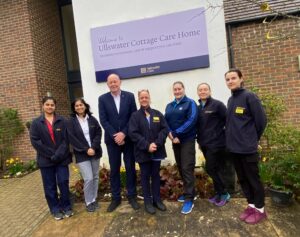 staff outside the care home building